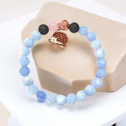 Charming Animal-Inspired Stone Bracelet: Adorn Your Wrist with a Whimsical Hedgehog Charm and Soft Blue Tones